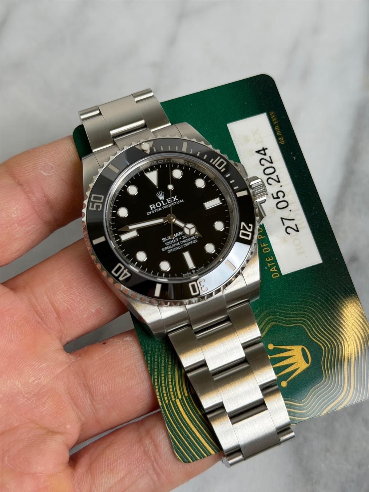 May be an image of wrist watch and text that says 'I 10 50 ROLEX .ROLEXUM ROI STERPER ETUAL UA SUE AARI SUUNCNANTCERTA . עה 40 בין BV'