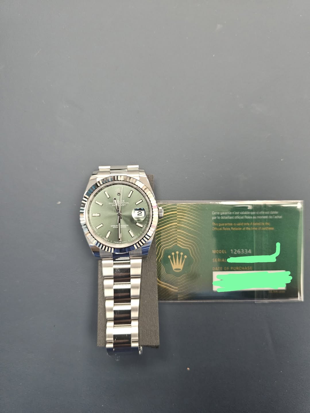 May be an image of wrist watch and text