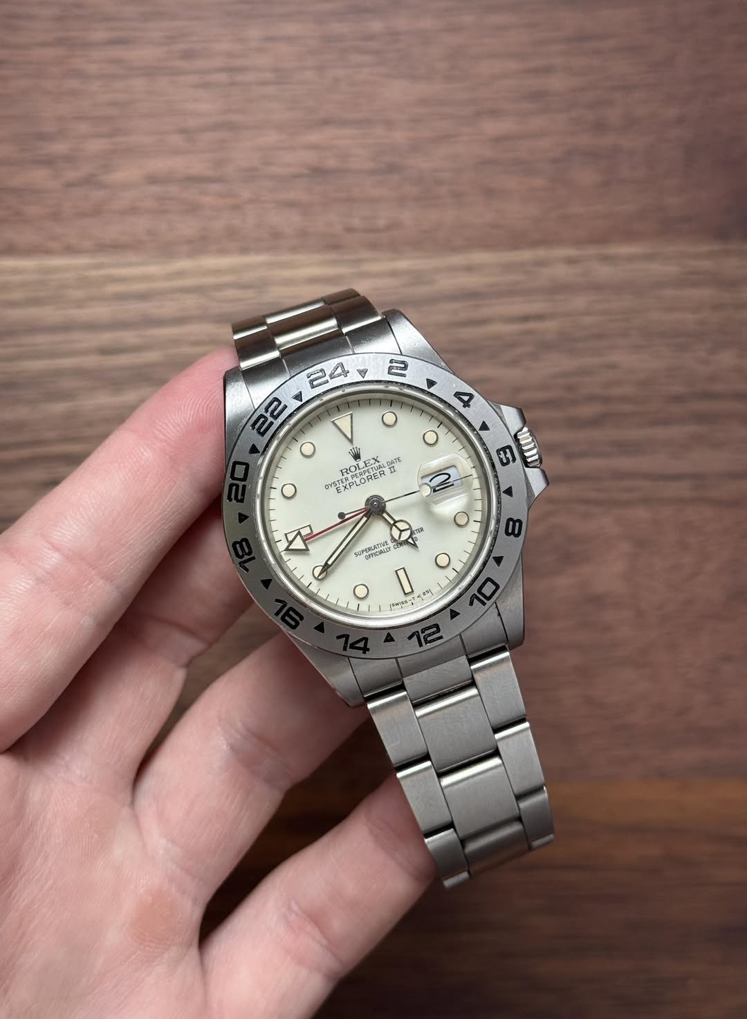 May be an image of wrist watch and text