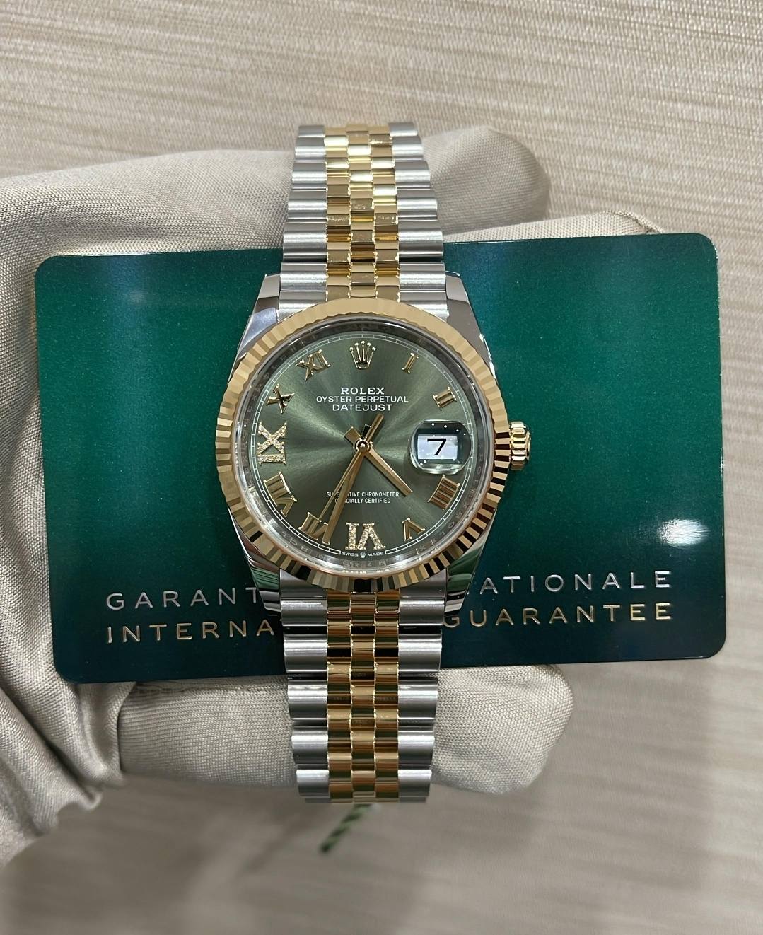 May be an image of wrist watch and text