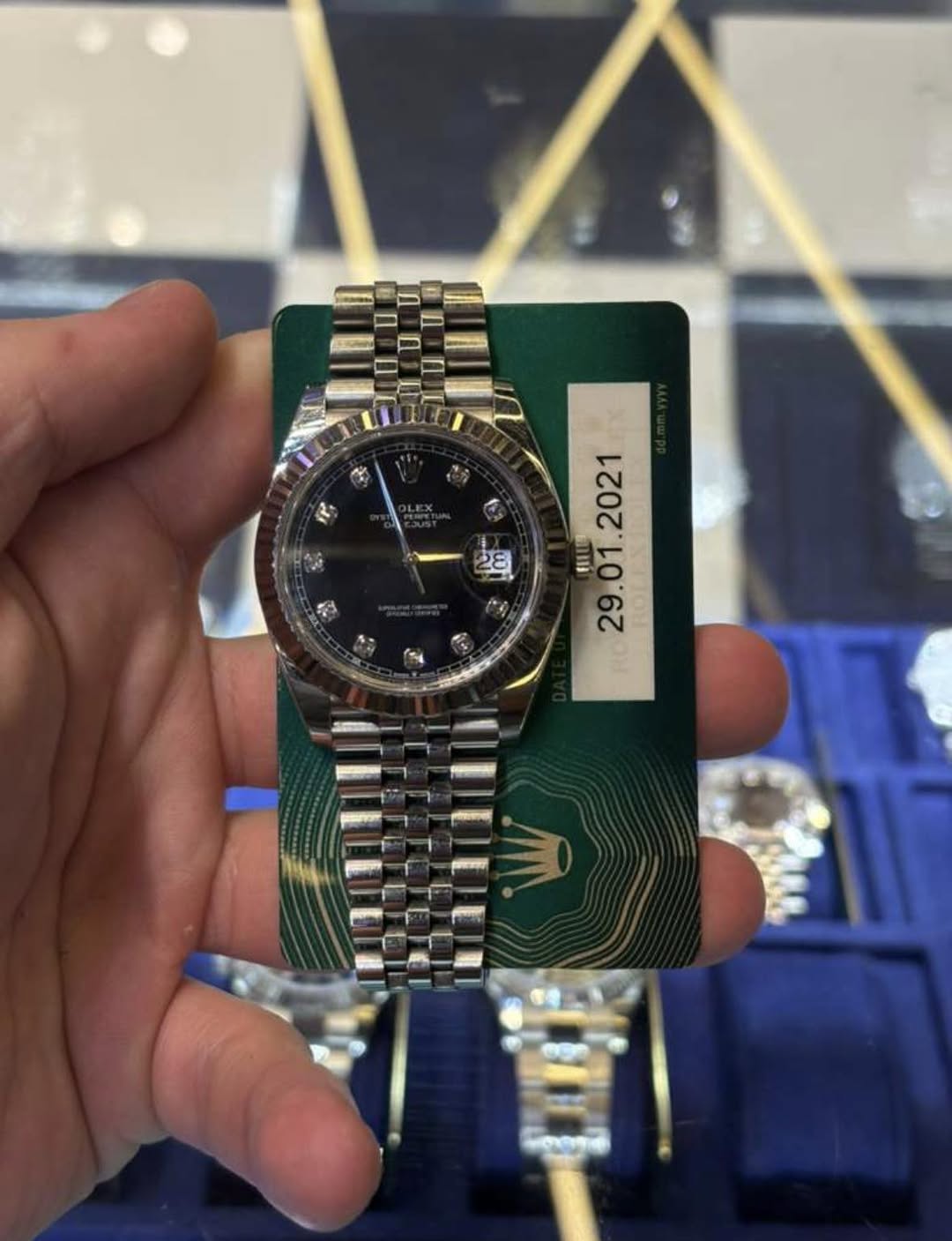 May be an image of wrist watch and text