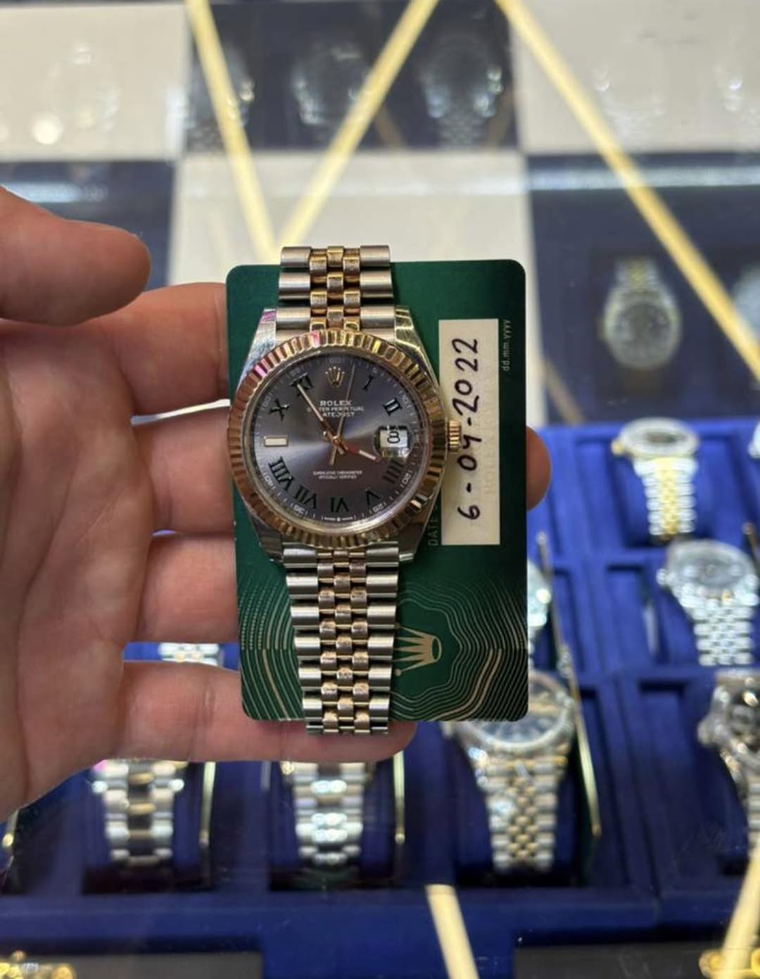 May be an image of wrist watch and text