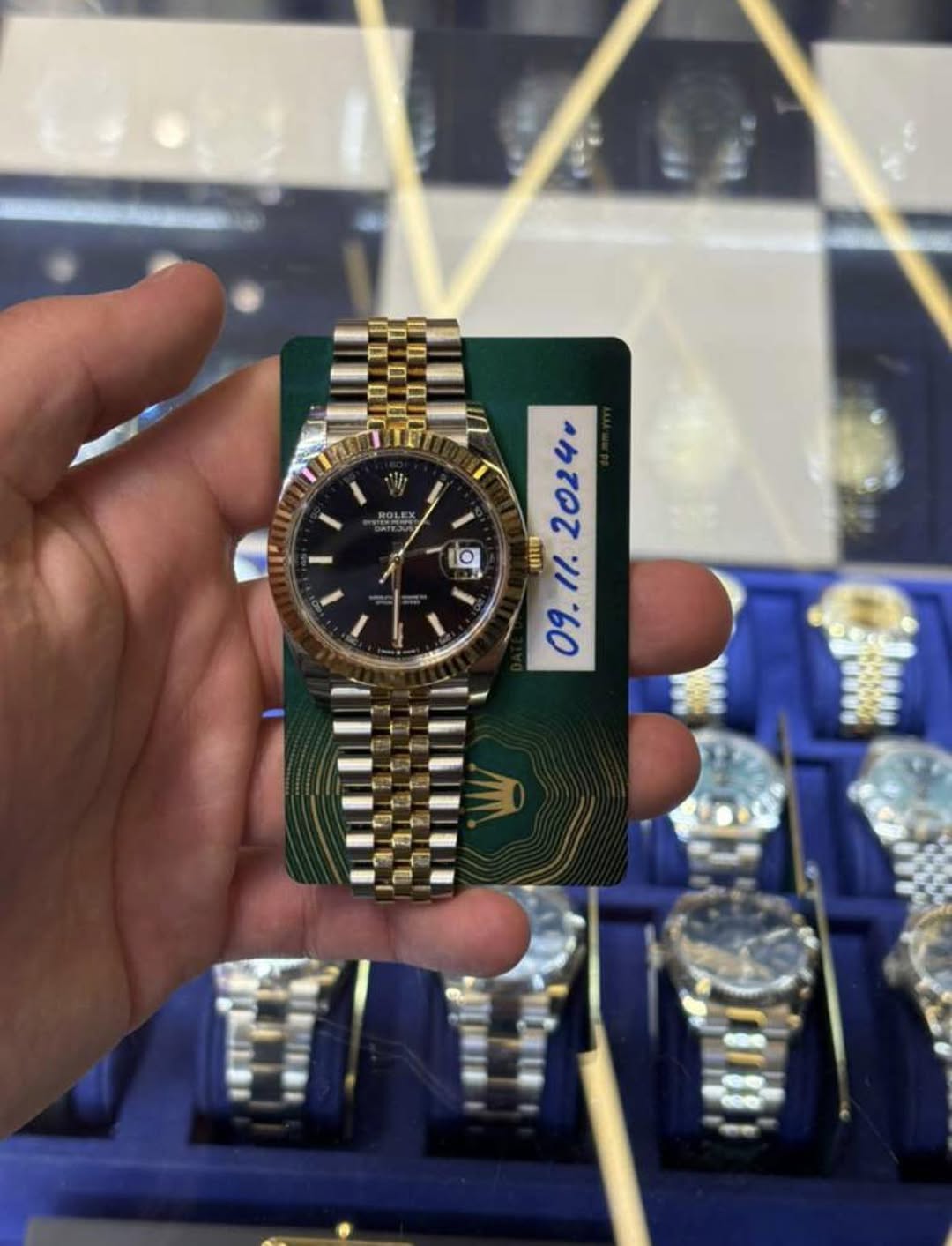 May be an image of wrist watch and text