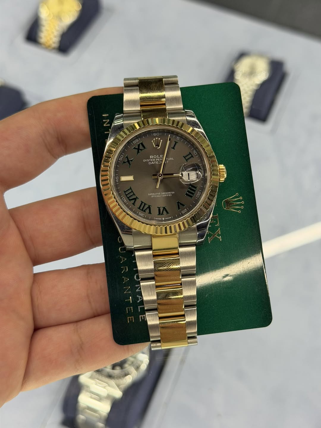 May be an image of wrist watch and text