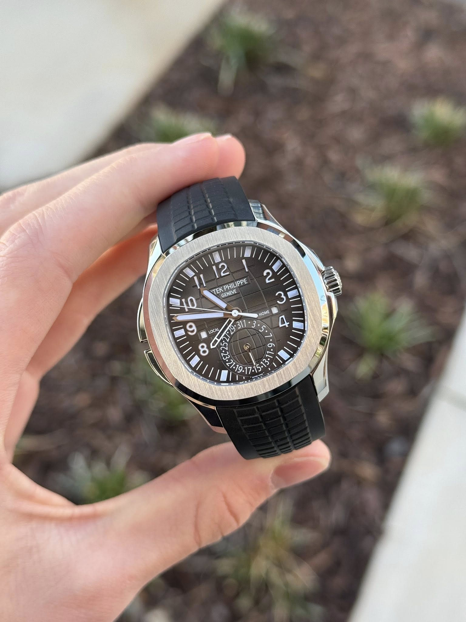 May be an image of wrist watch and text that says '12 TEK TEK PHILIPPE IPPE GENEVE PUME 10 2 3 HOME 11. 6 6 NOUAN DCAL C = -'