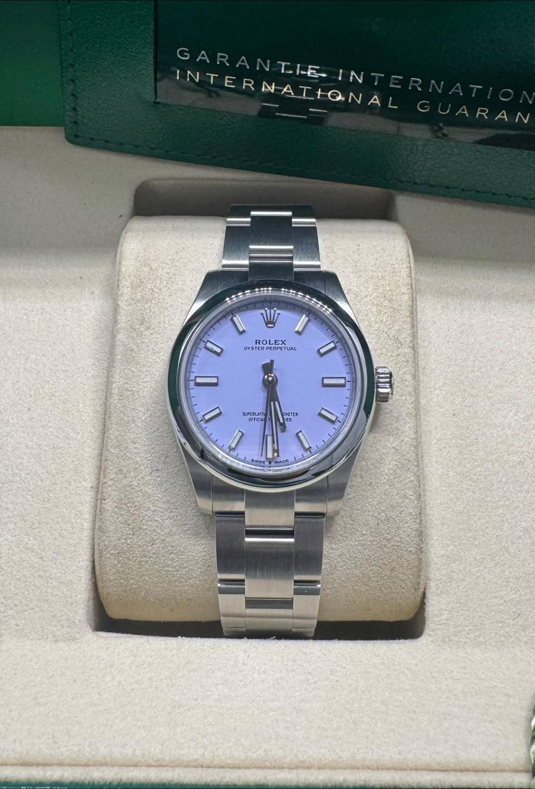 May be an image of wrist watch and text