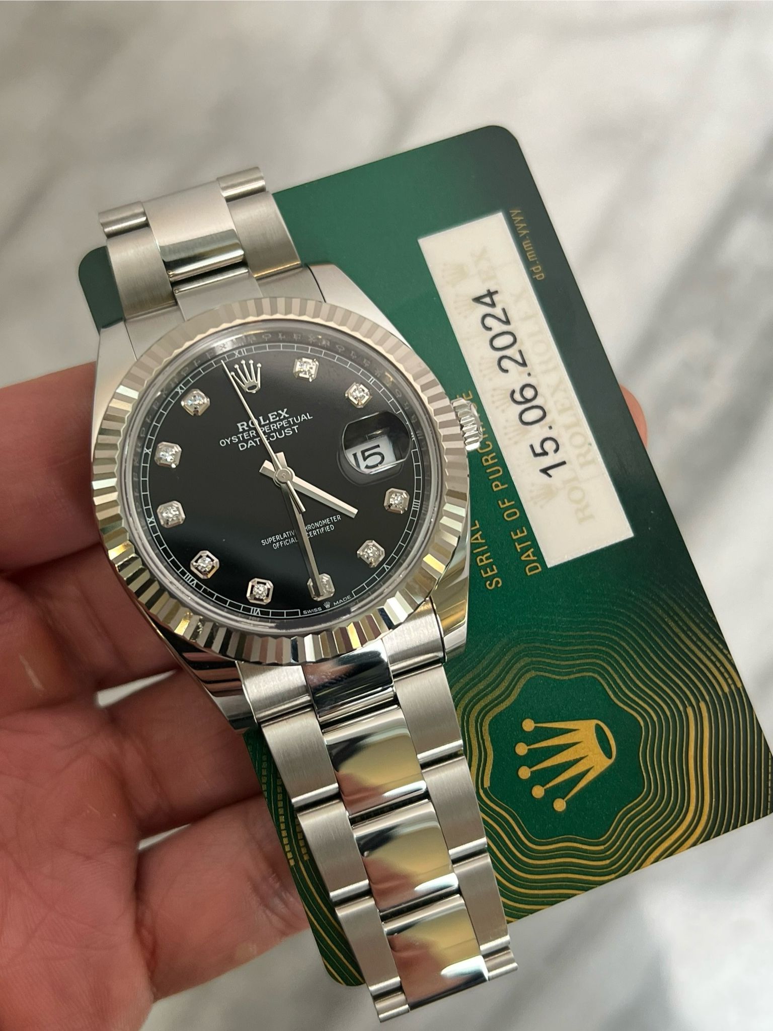 May be an image of wrist watch and text