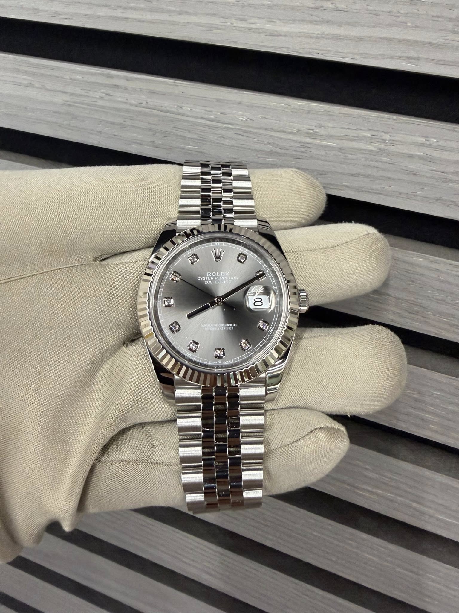 May be an image of wrist watch and text