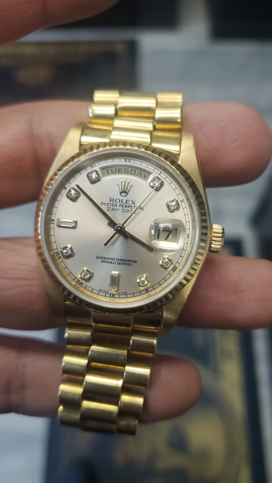 May be an image of wrist watch and text