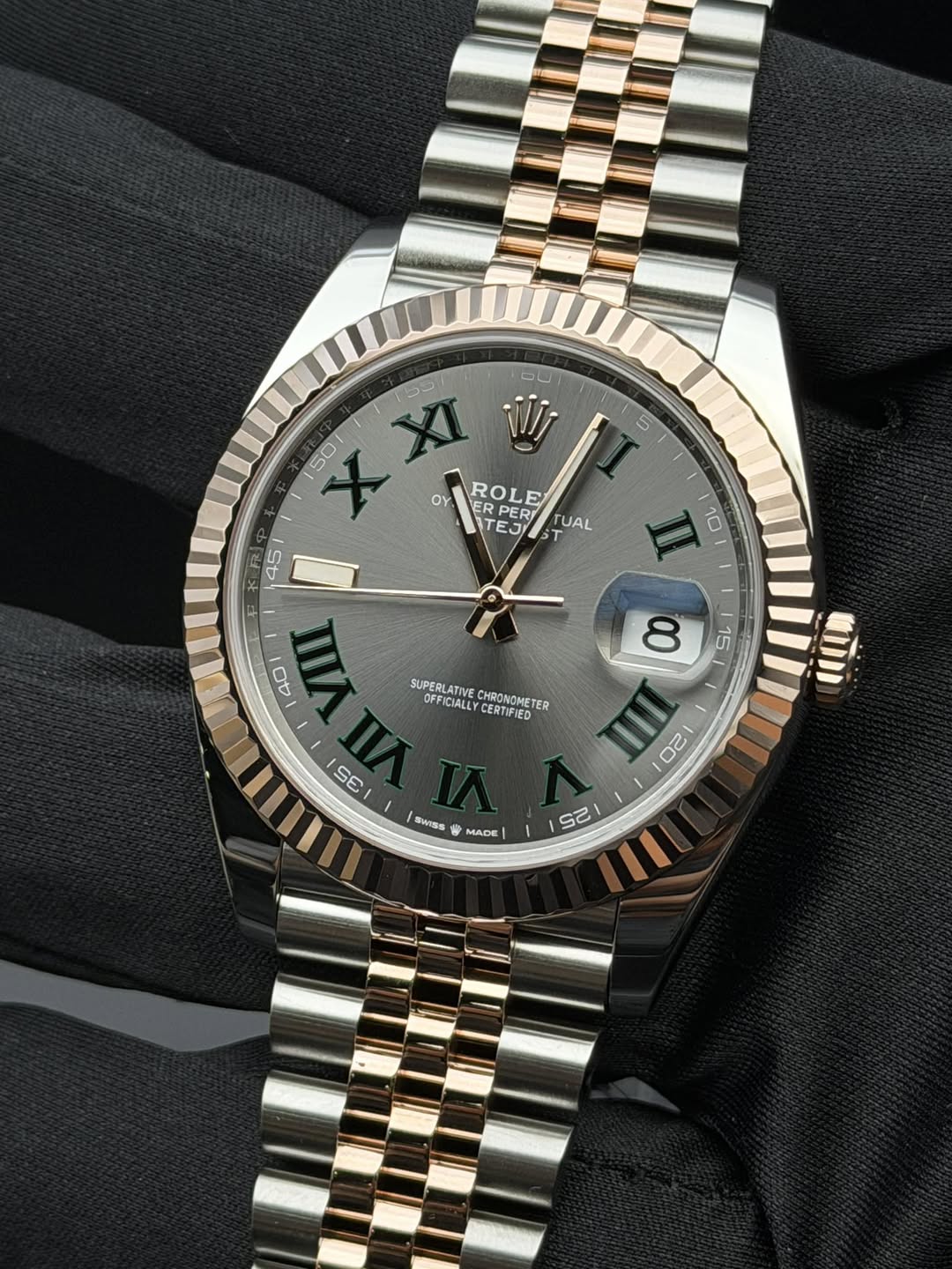 May be an image of wrist watch and text