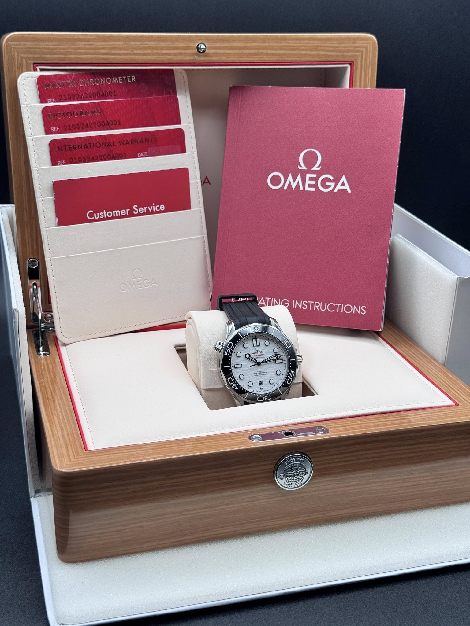 May be an image of wrist watch and text that says 'Customer CustomerService Service ח OMEGA OMECA JIE ATINGINSTRUCTIONS ATING INSTRUCTIONS ٥ W U O 09'