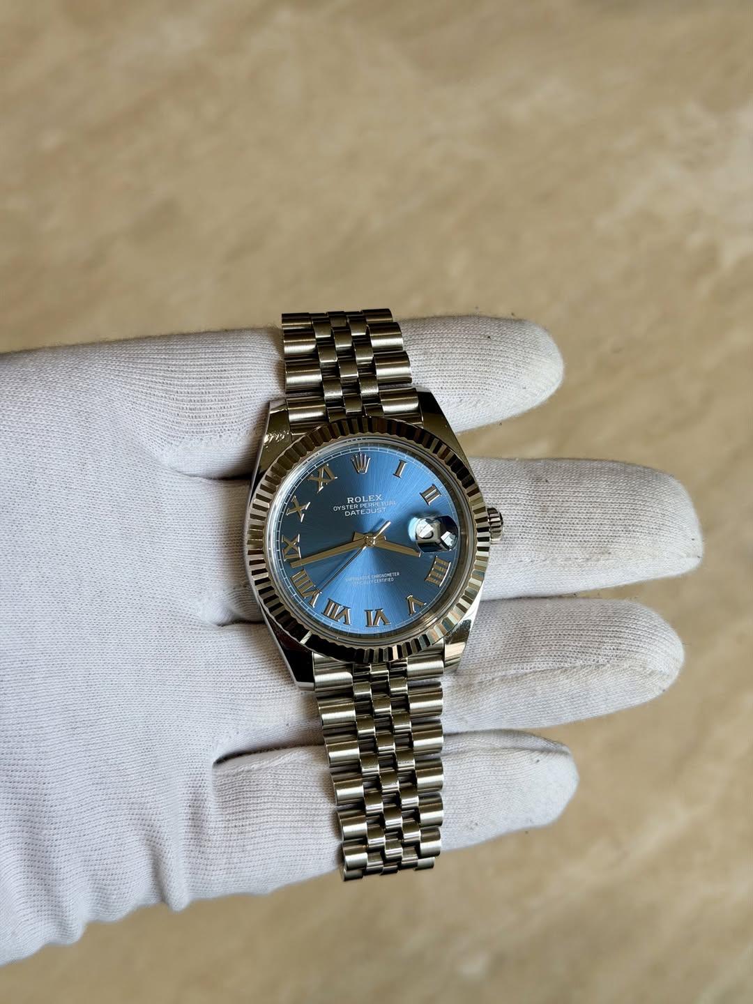 May be an image of wrist watch and text