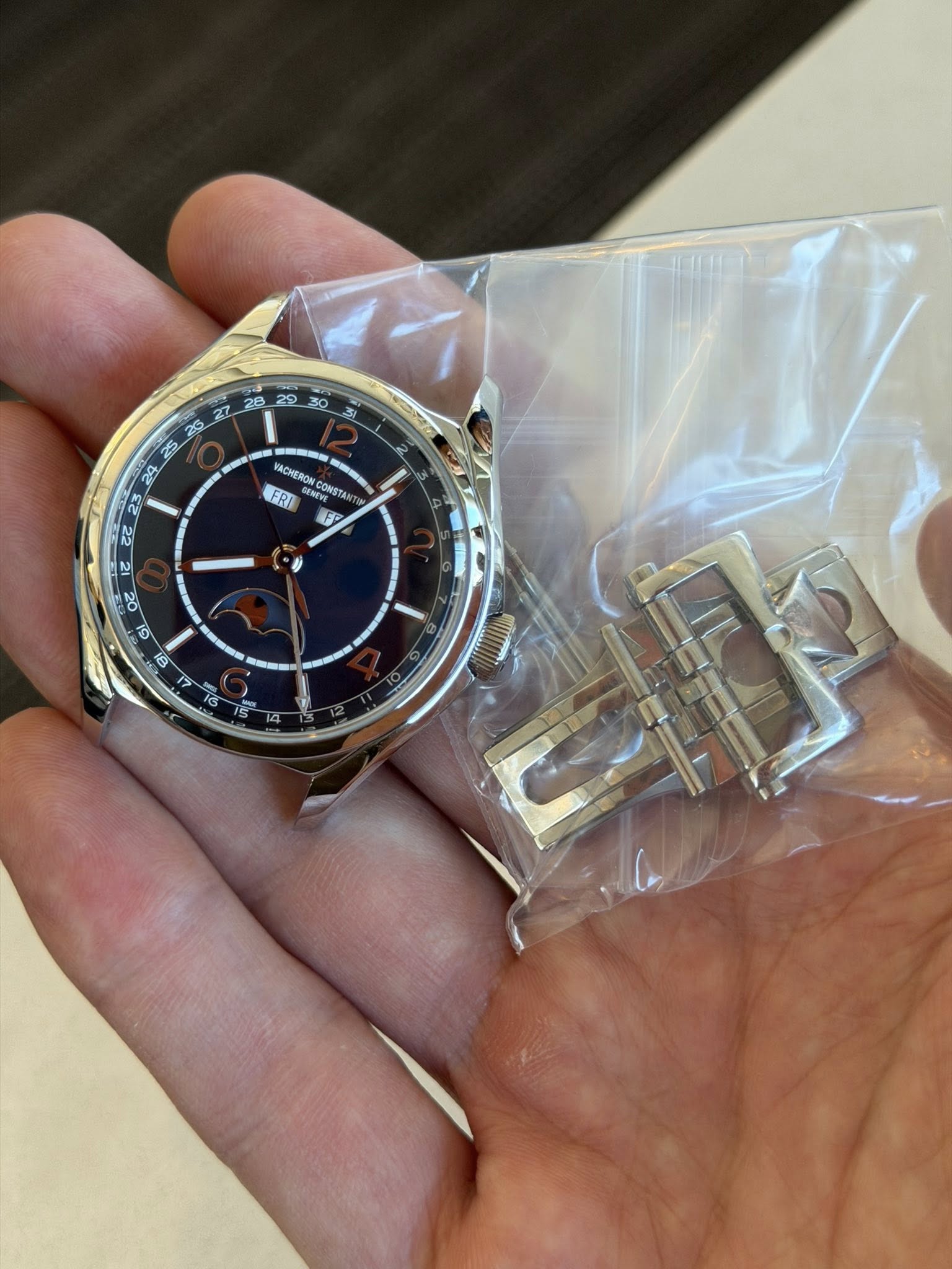 May be an image of wrist watch and text