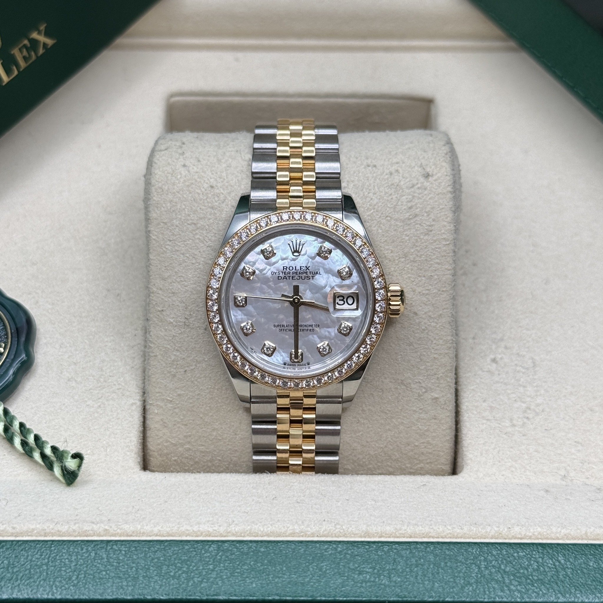 May be an image of wrist watch and text