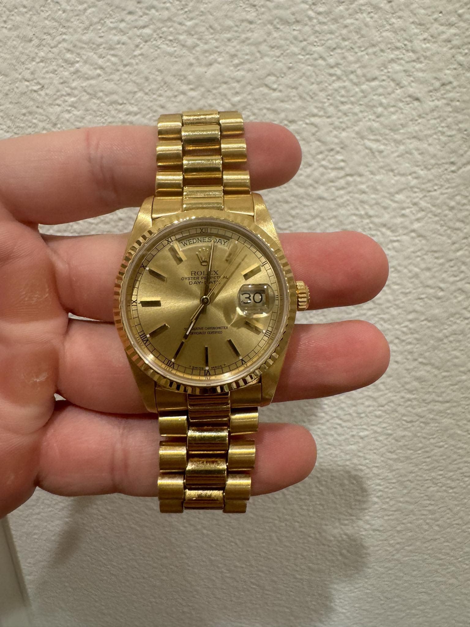 May be an image of wrist watch and text