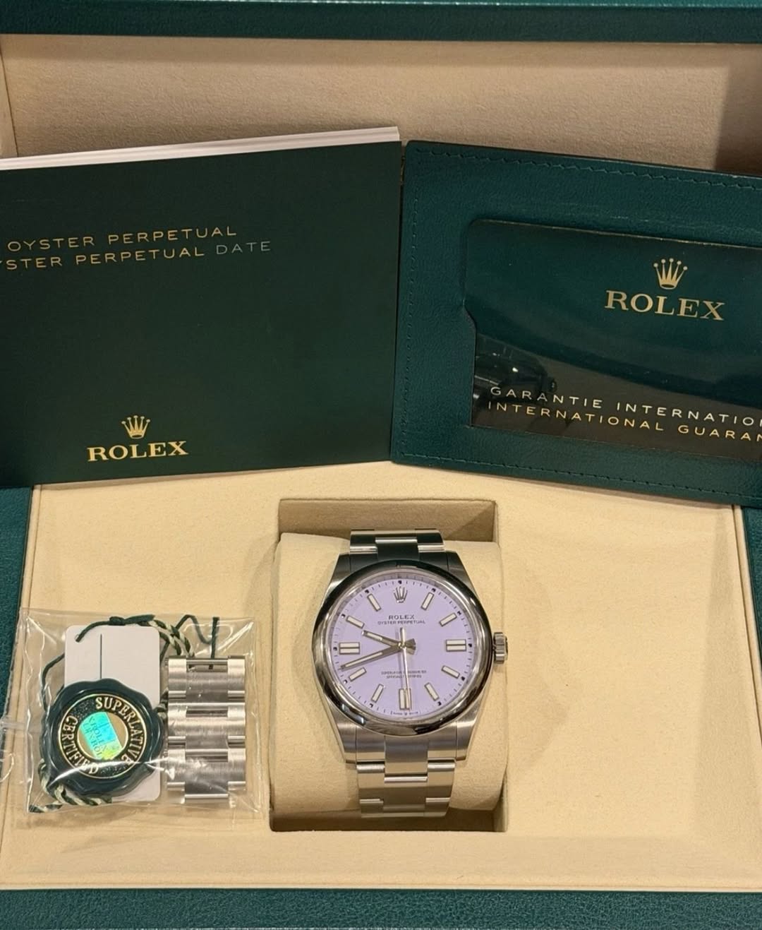 May be an image of wrist watch and text that says 'YSTERPERPETUAL TUAL PERPETUAL TERPERPETUAL PERPET TUAL ROLEX ROLEX GARA GARANTIE NTIE INTERNATIO NTERNATIONAL GARANTIEINTER…