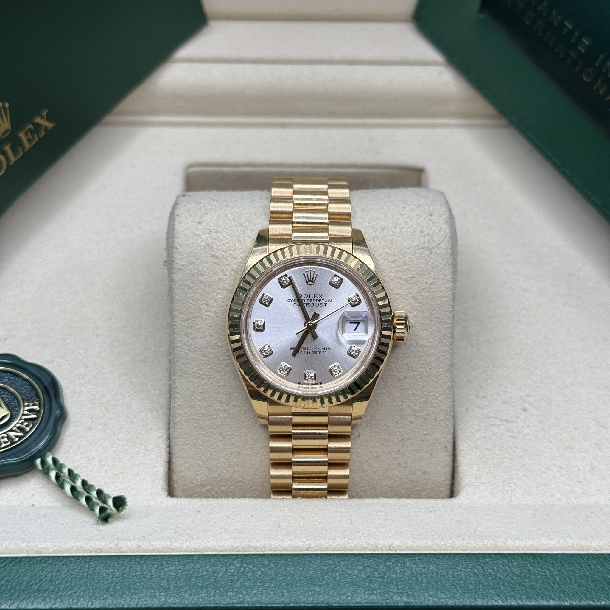 May be an image of wrist watch and text