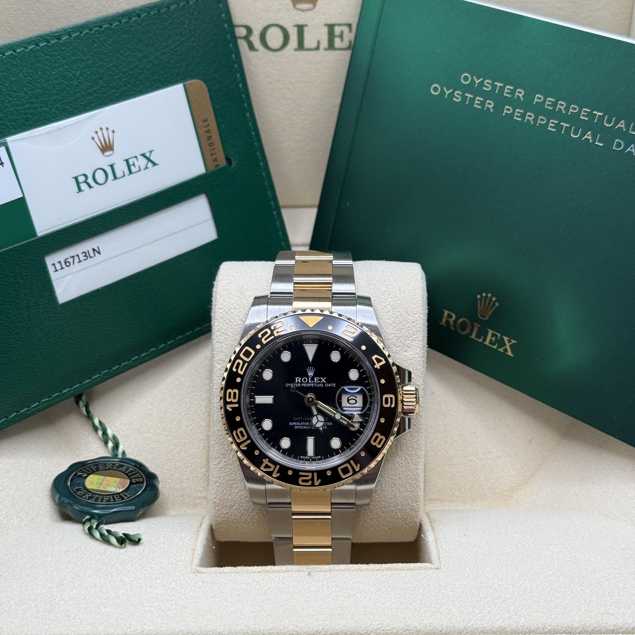 May be an image of wrist watch and text that says 'ROLE ROLEX OYSTER PERPETUAL PERPETUAL ΠΕΕPETυA D OYSTER PERPETUA 116713LN بت Q'