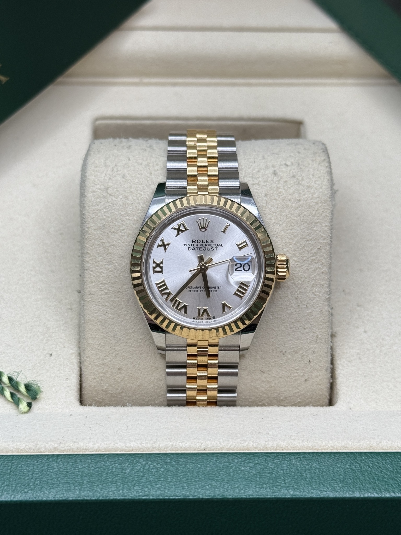 May be an image of wrist watch and text