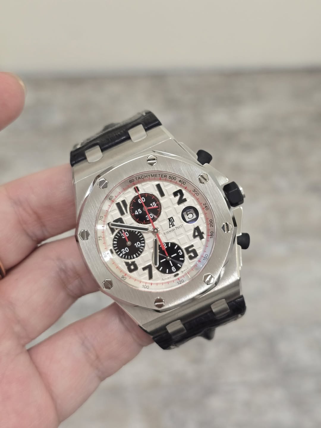 May be an image of wrist watch and text