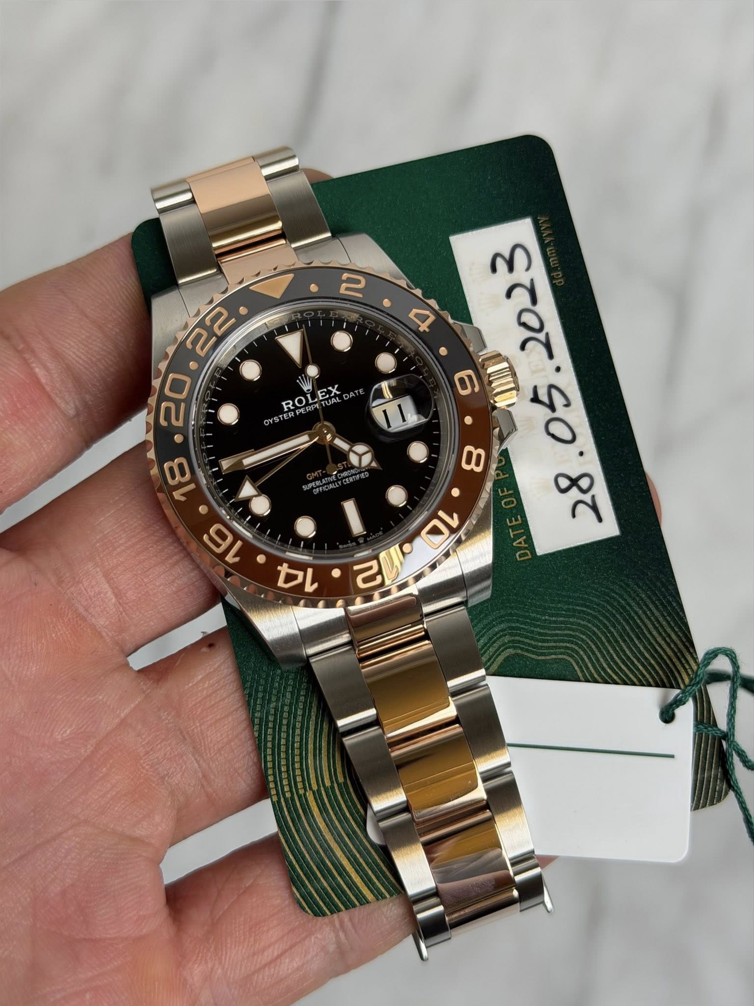 May be an image of wrist watch and text that says 'ROLEX 22 ه ល 20 ៣ A 己リ・ロ O 1L 3 0 S0'