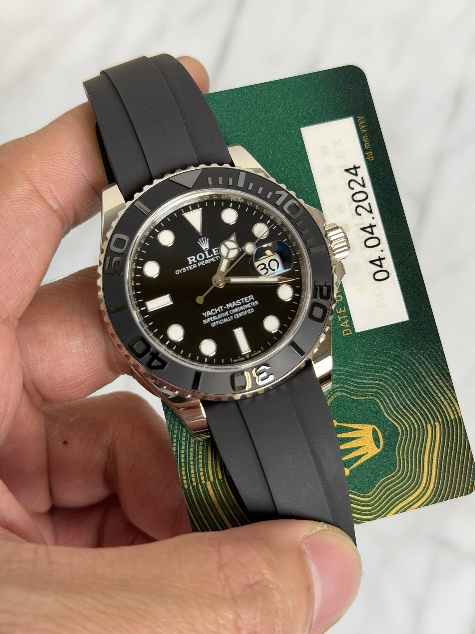 May be an image of wrist watch and text that says 'HIILHI7C 1C ROLE TERPERPET PERPET or STE TE . YACHT PERLAvE CERTUED MAST MASTER TER CU DAT ω 3'