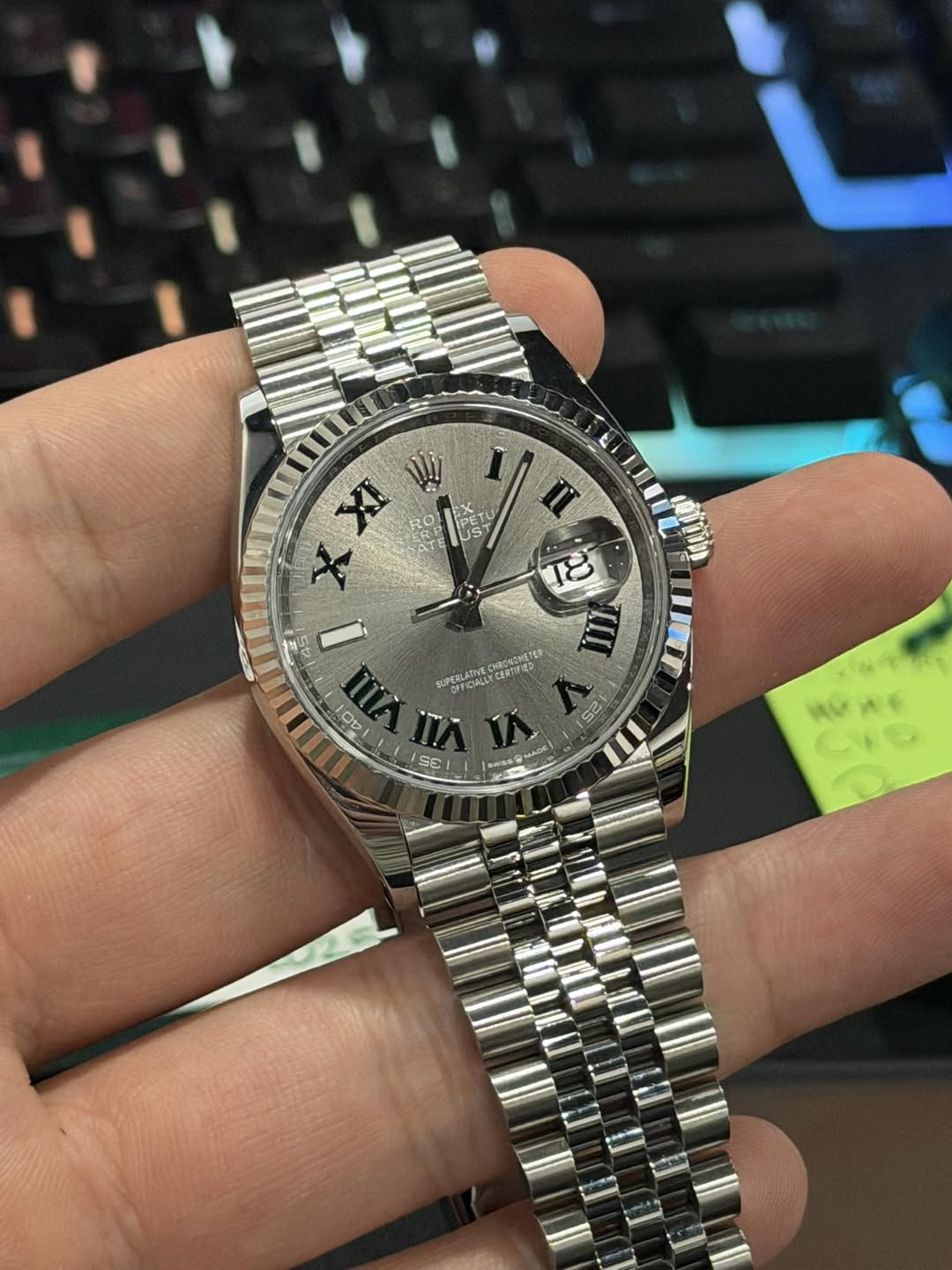 May be an image of wrist watch and text