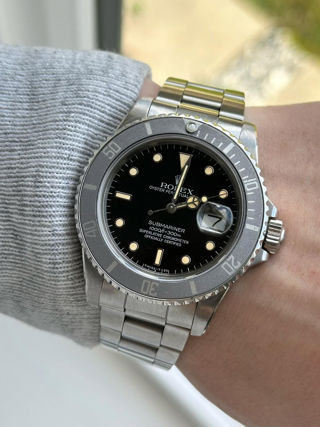 May be an image of wrist watch and text