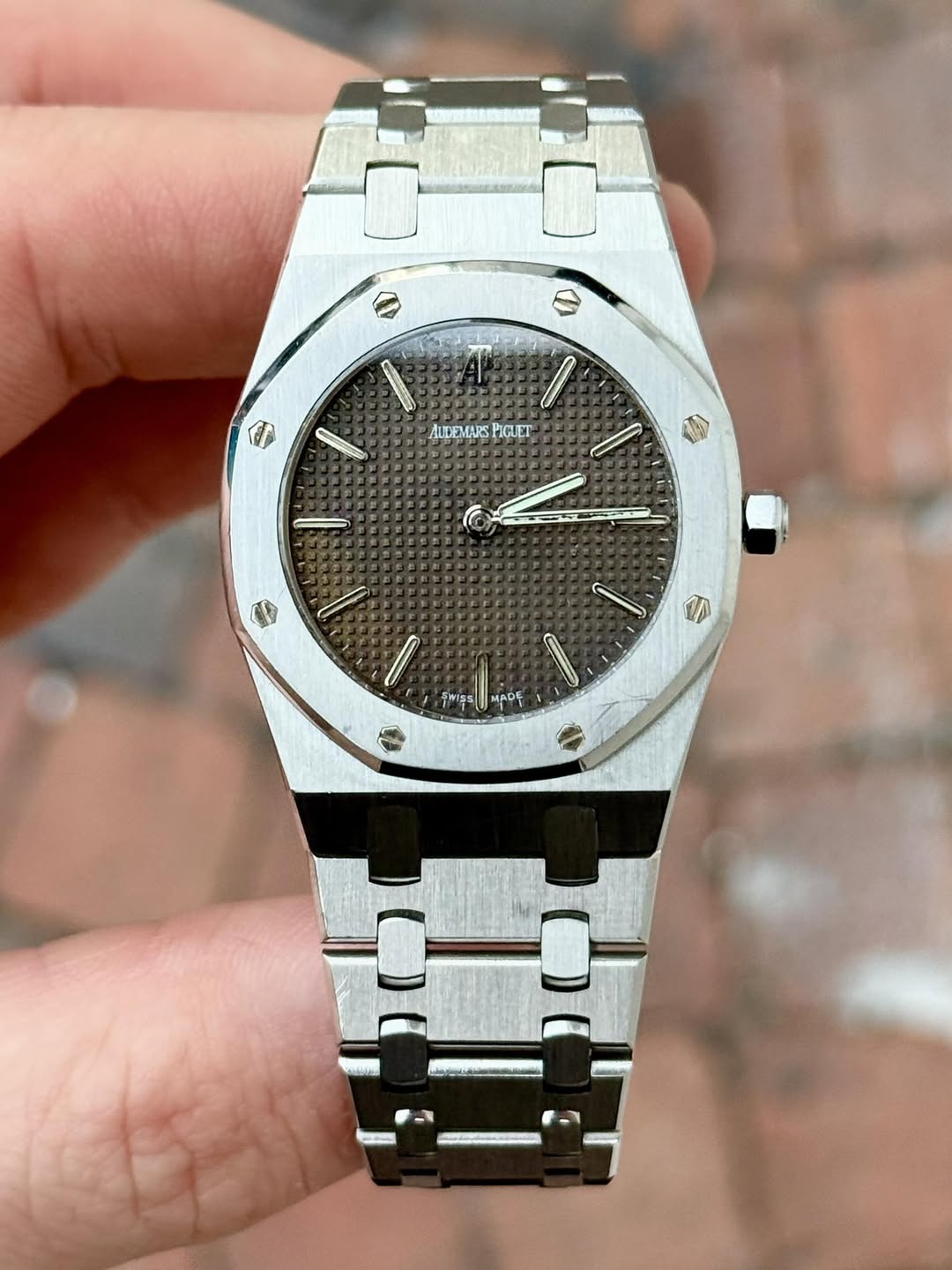 May be an image of wrist watch and text