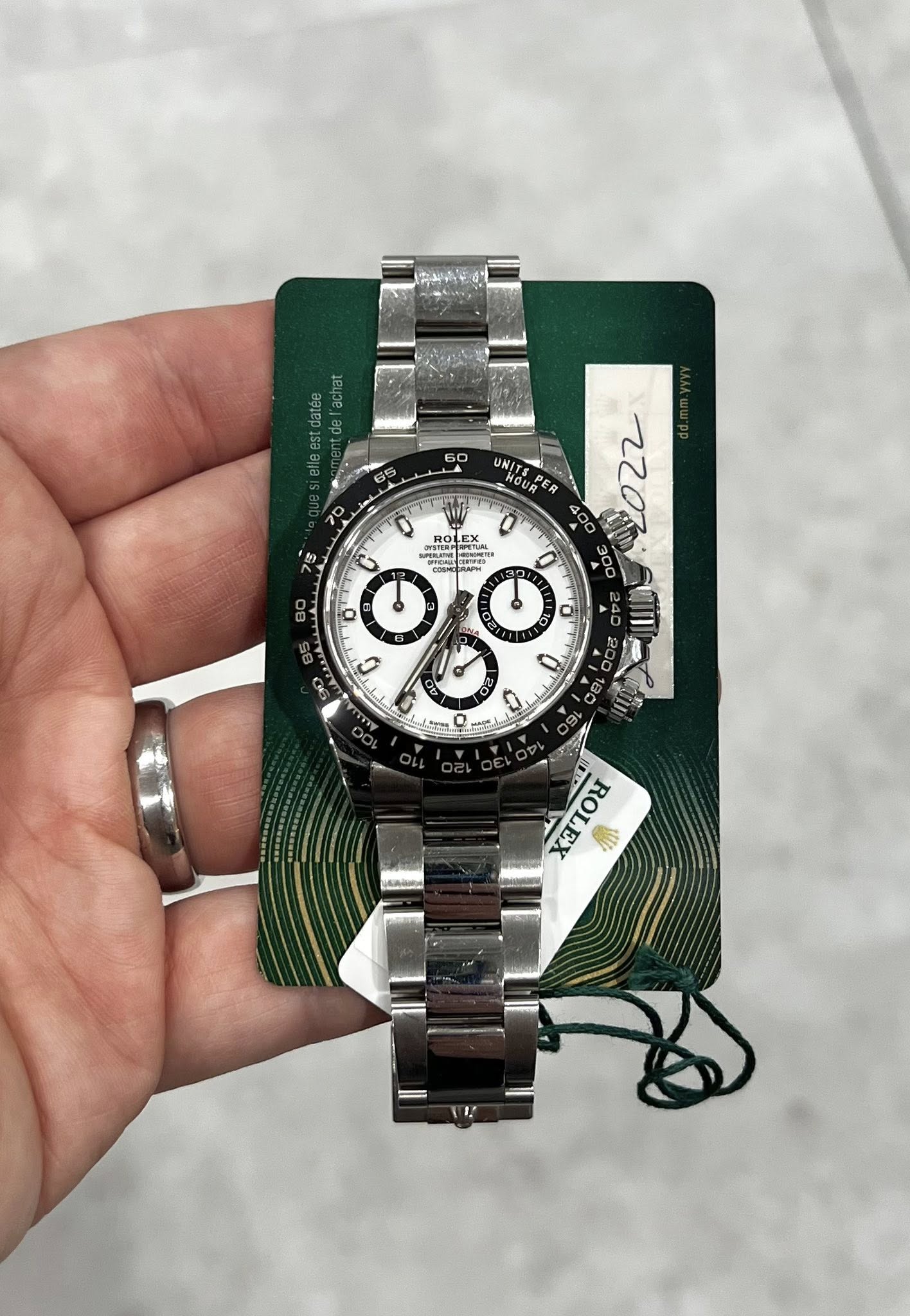 May be an image of wrist watch and text