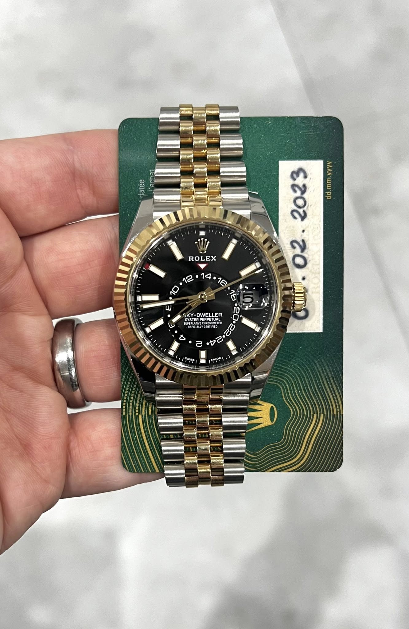 May be an image of wrist watch and text