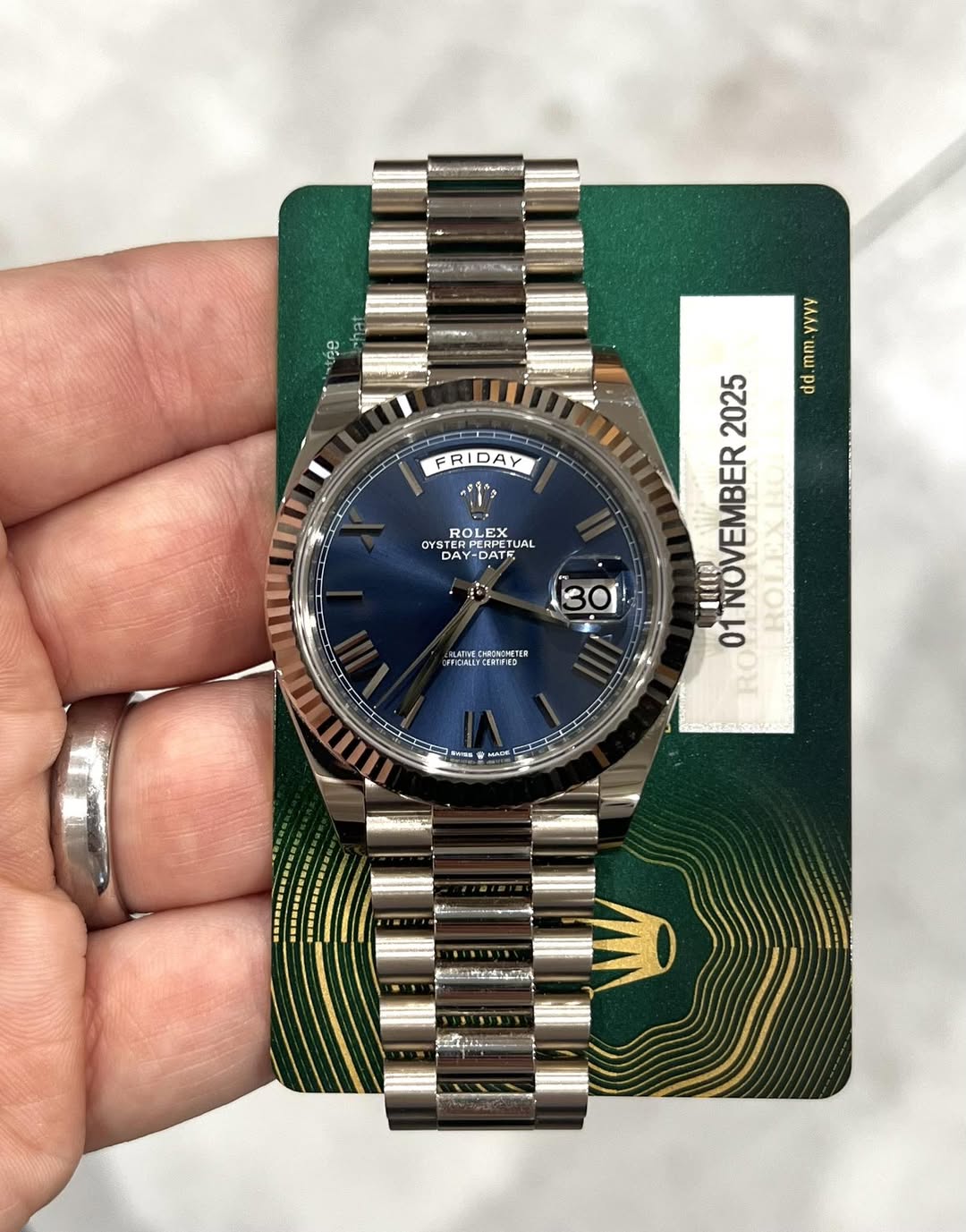 May be an image of wrist watch and text