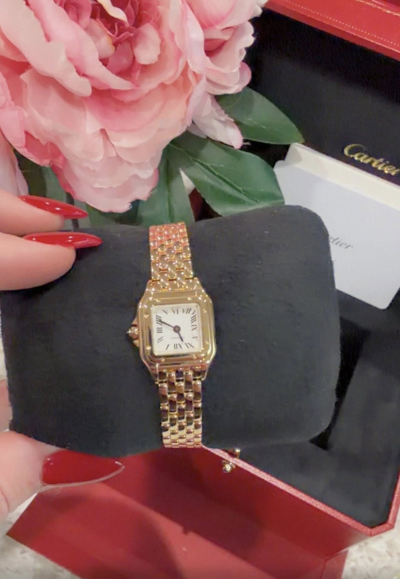 May be an image of wrist watch and text