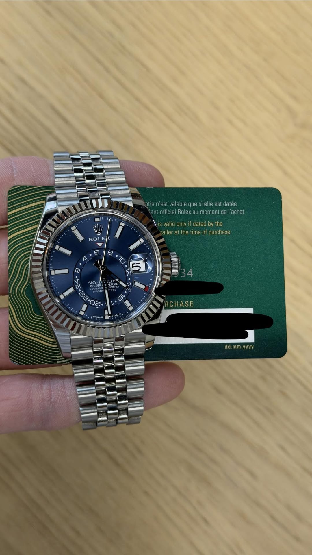 May be an image of wrist watch and text