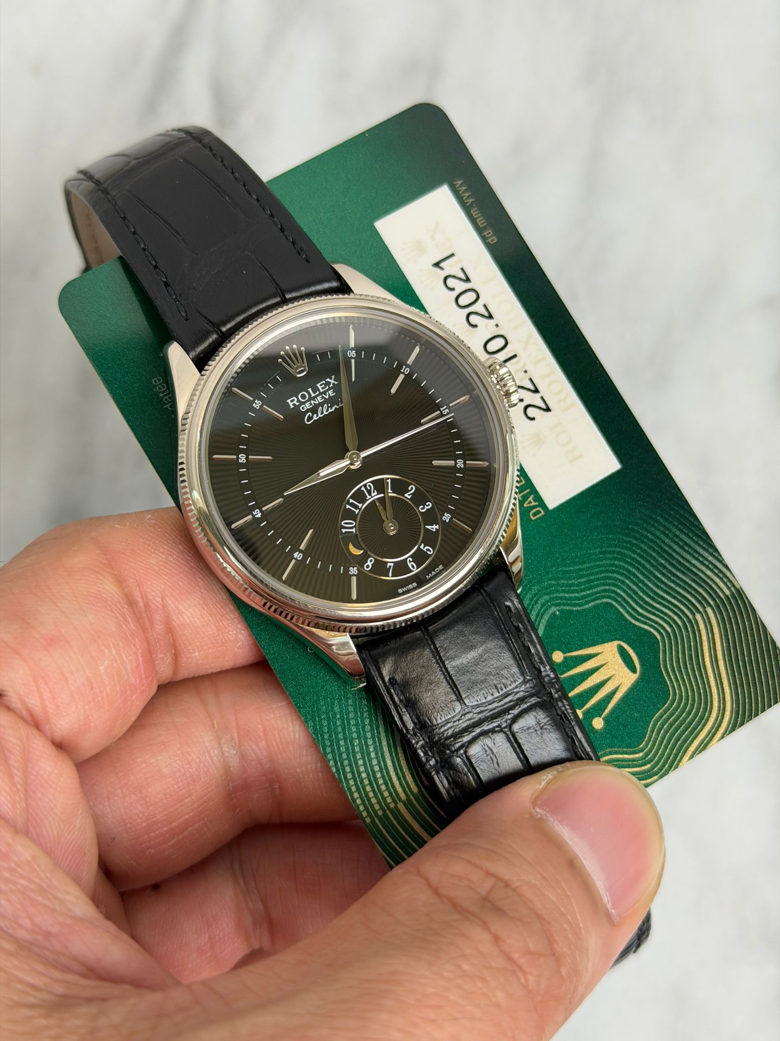 May be an image of wrist watch and text