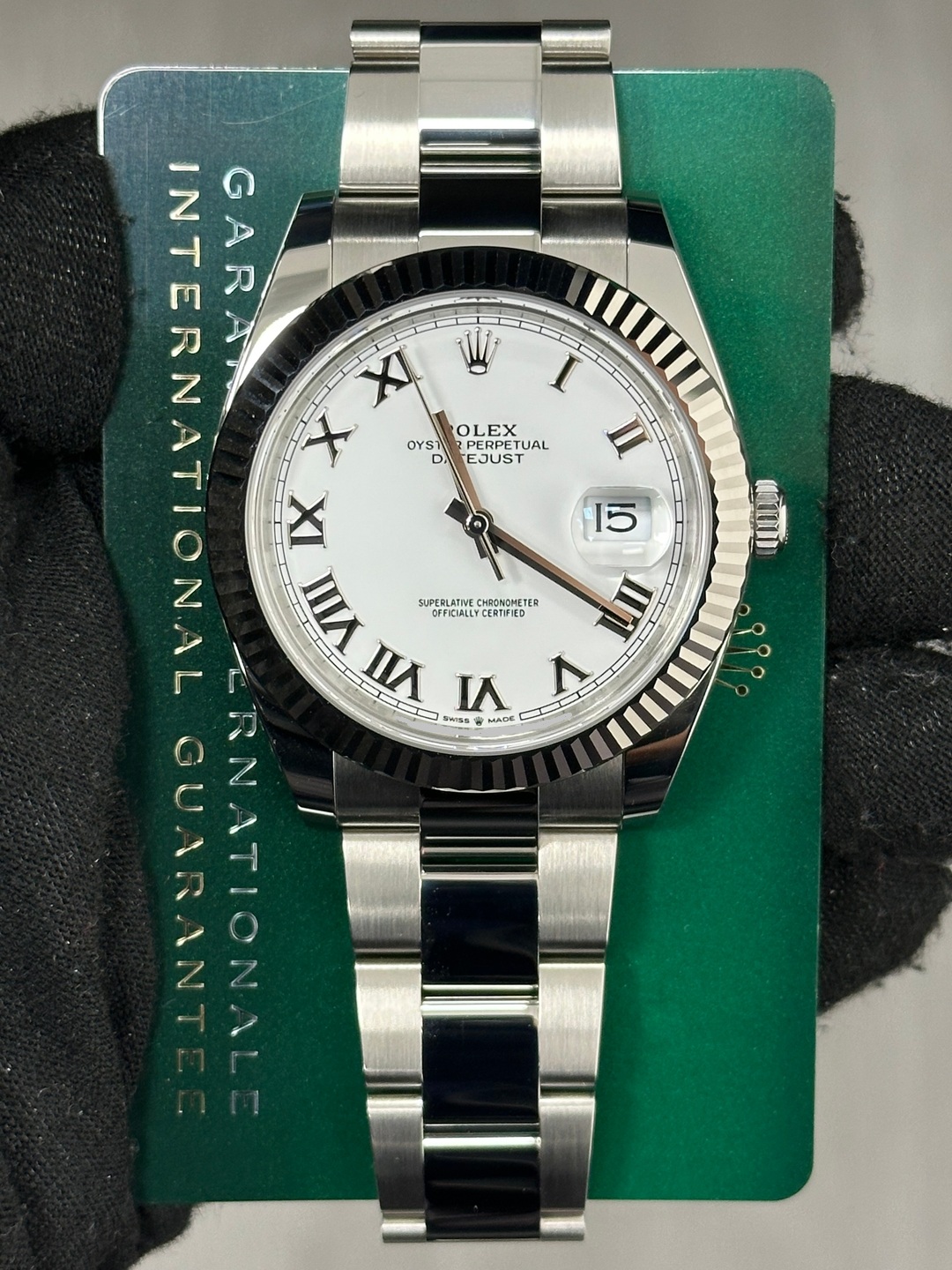 May be an image of wrist watch and text that says 'OLEX PERPETUAL EJUST II INTERNATIONAL XERNAT 日 z GARAN NTERNA XI W X OYS L IIA ー 15 SUPERLATINE CHRONDMETER OFFCULLYCERTFIEO 1 VI…