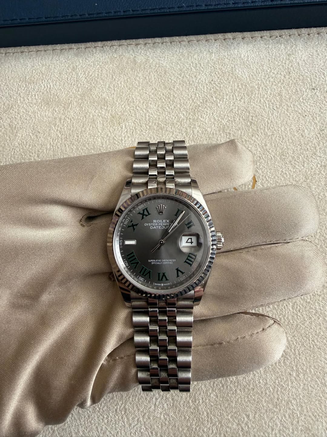 May be an image of wrist watch and text