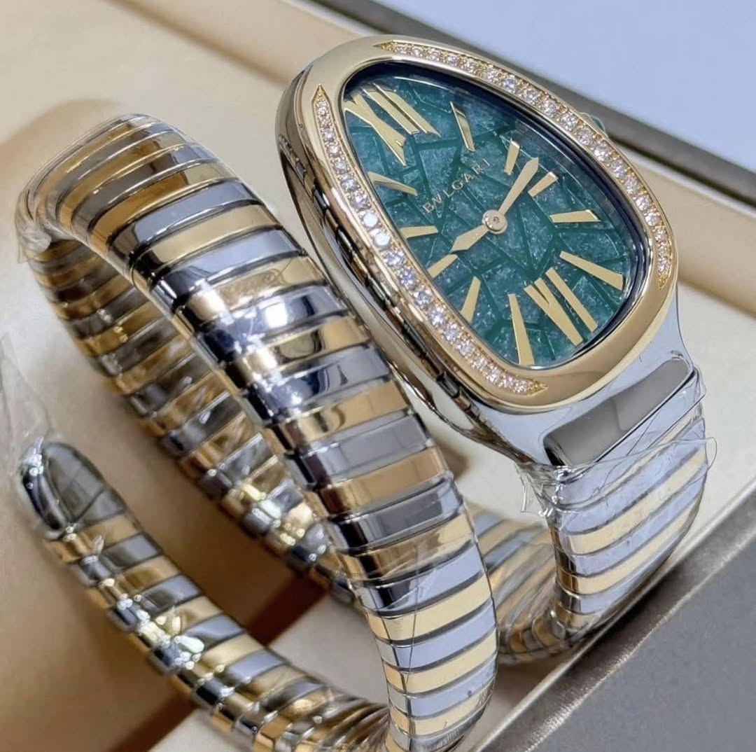 May be an image of jewelry, wrist watch and text