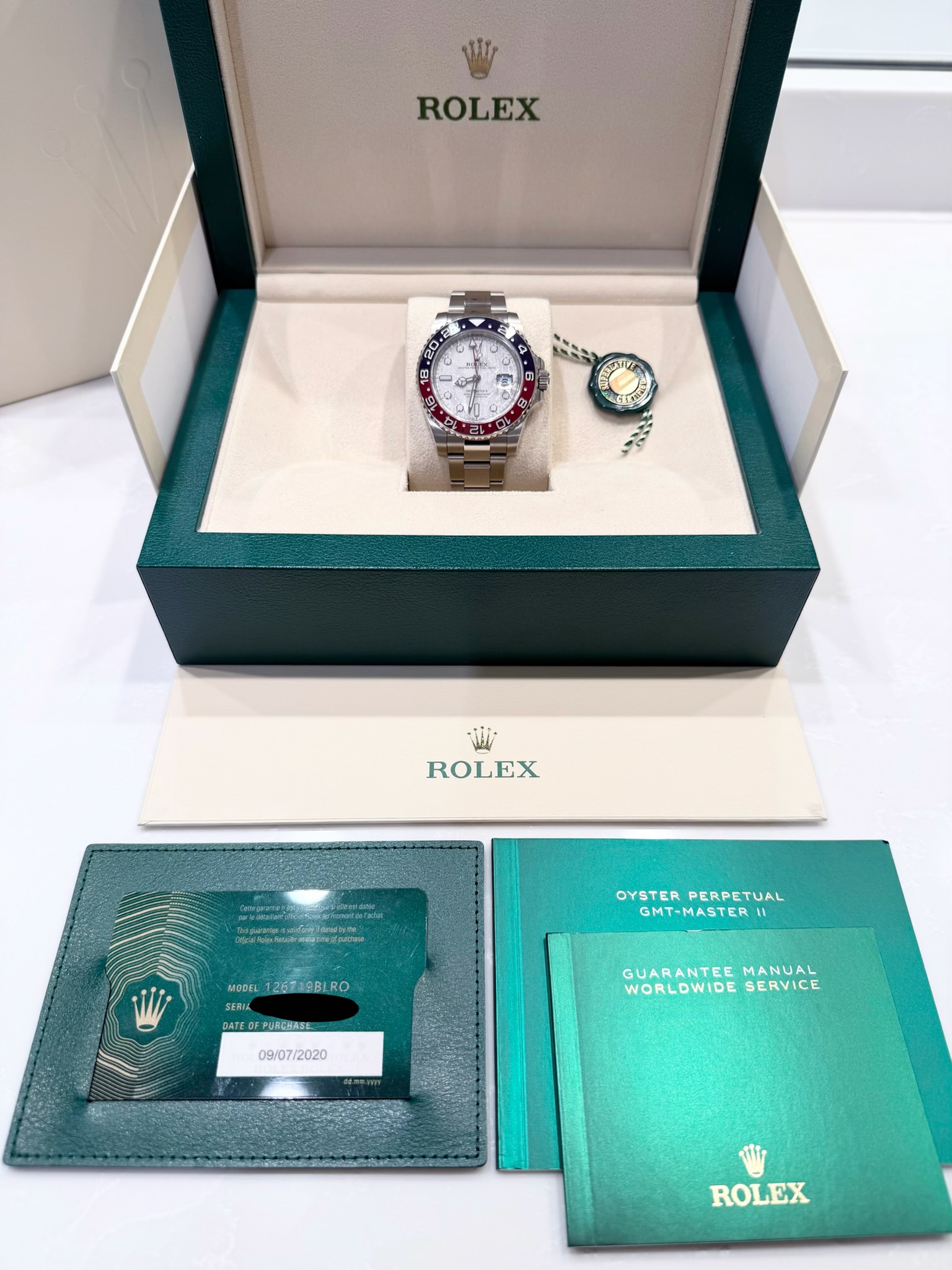 May be an image of wrist watch and text that says 'ROLEX & KBC 생0품: ل ROLEX ผุ OYSTERPERETUAL GMT-MASTER GMT-MASTER OYSTER PERPETUAL MODEL GOEL1267a9BIRO MOOE12672RBLRO RO SERIL…