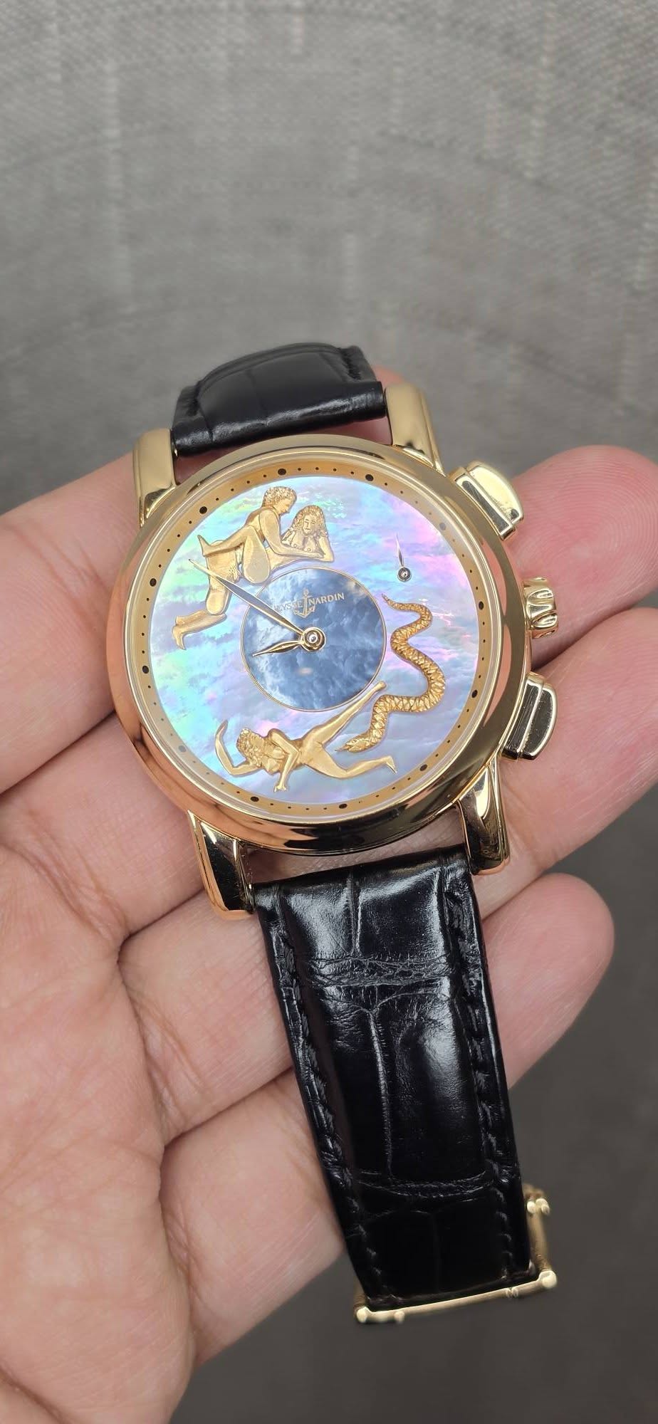 May be an image of wrist watch and text