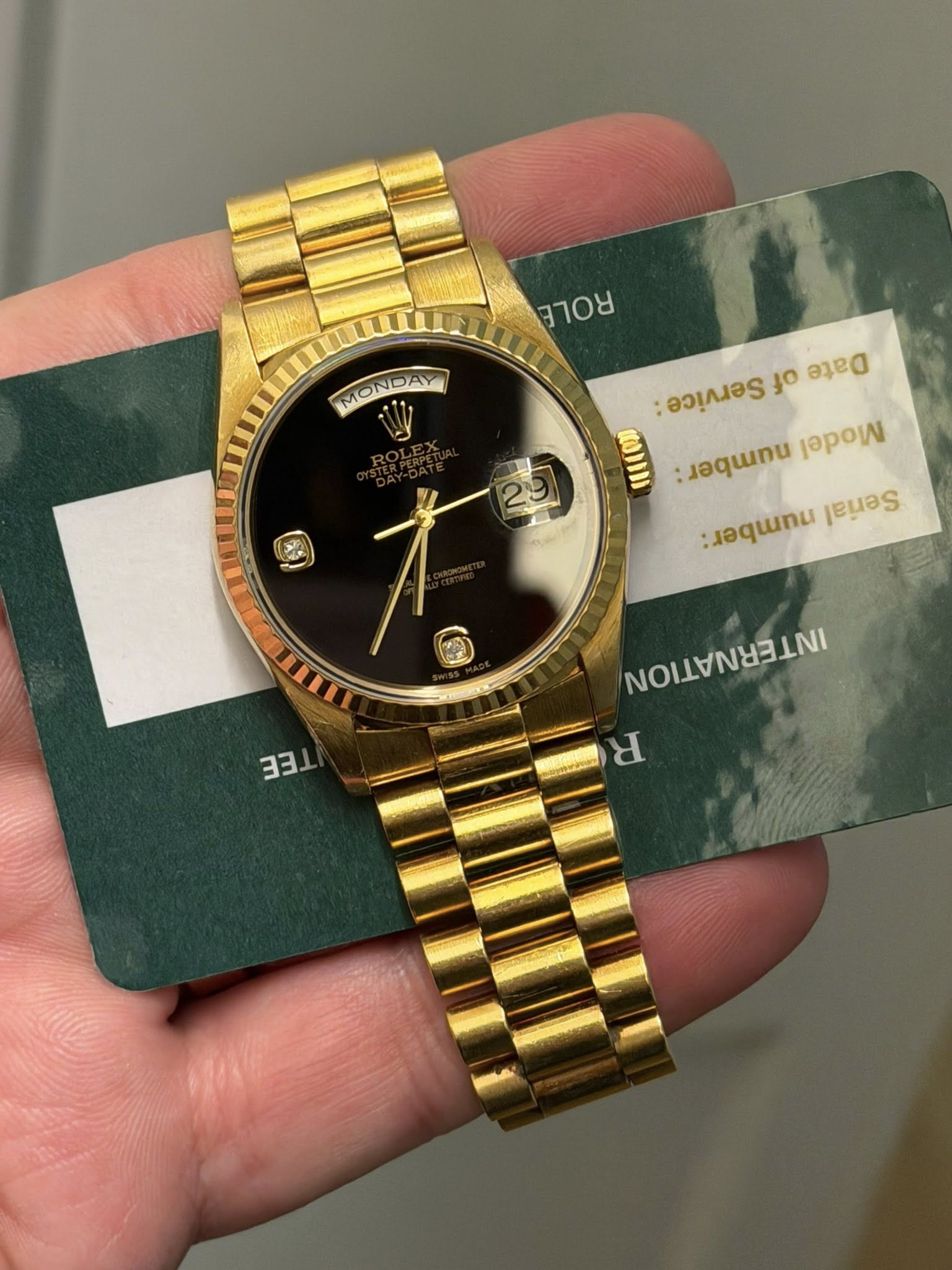May be an image of wrist watch and text