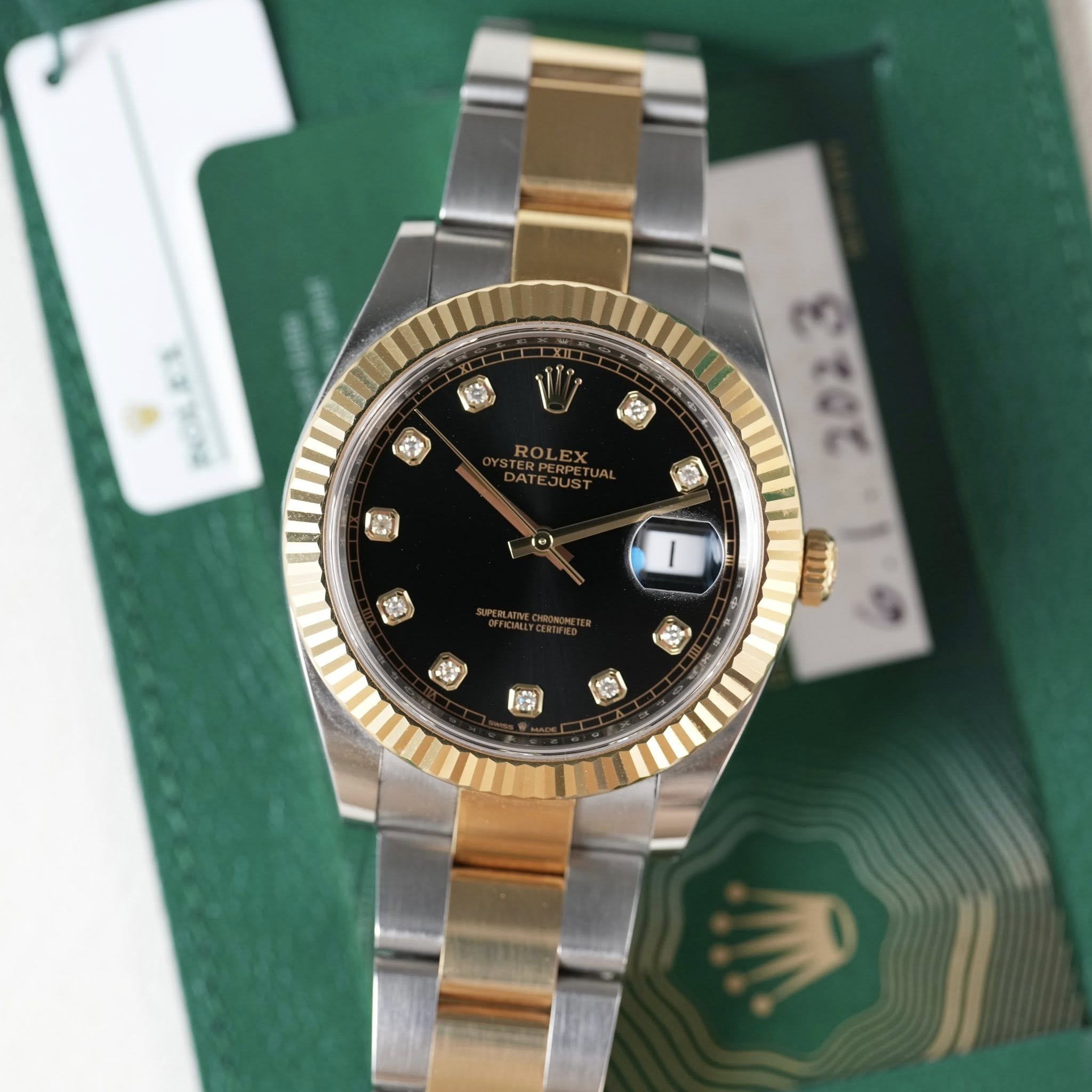 May be an image of wrist watch and text