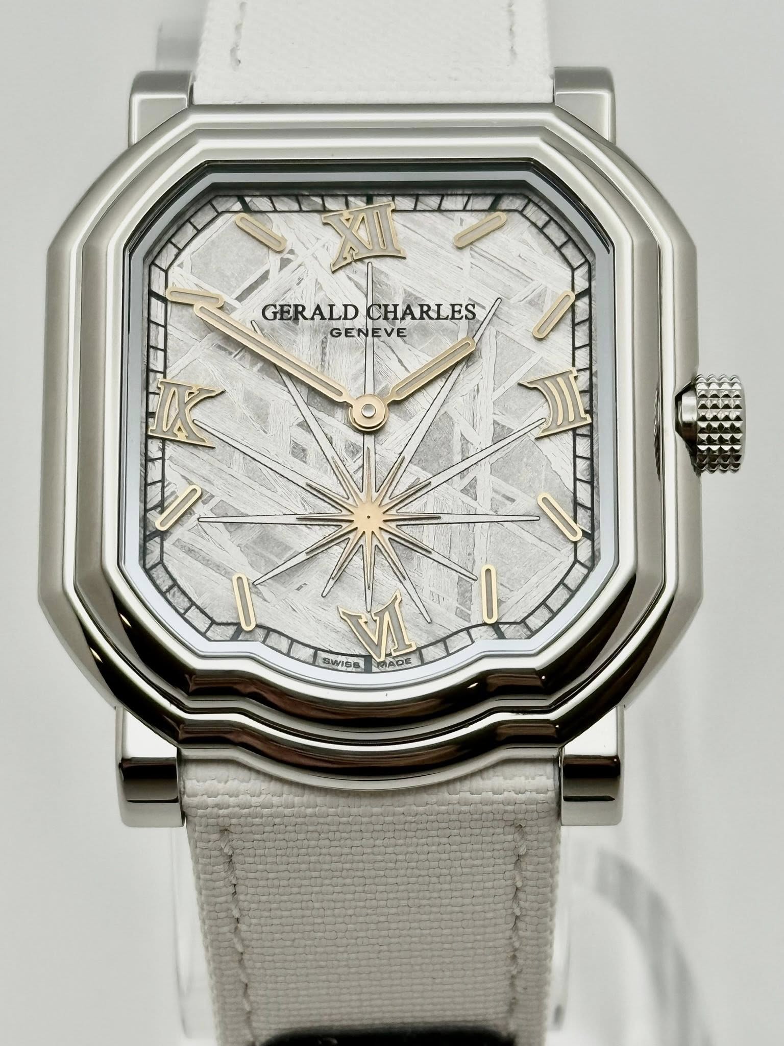 May be an image of wrist watch and text that says 'GERALD GERALDCHARLES GERALDCHARLES CHARLES GENEVE - SWIDE ኢዋን MADE OE'
