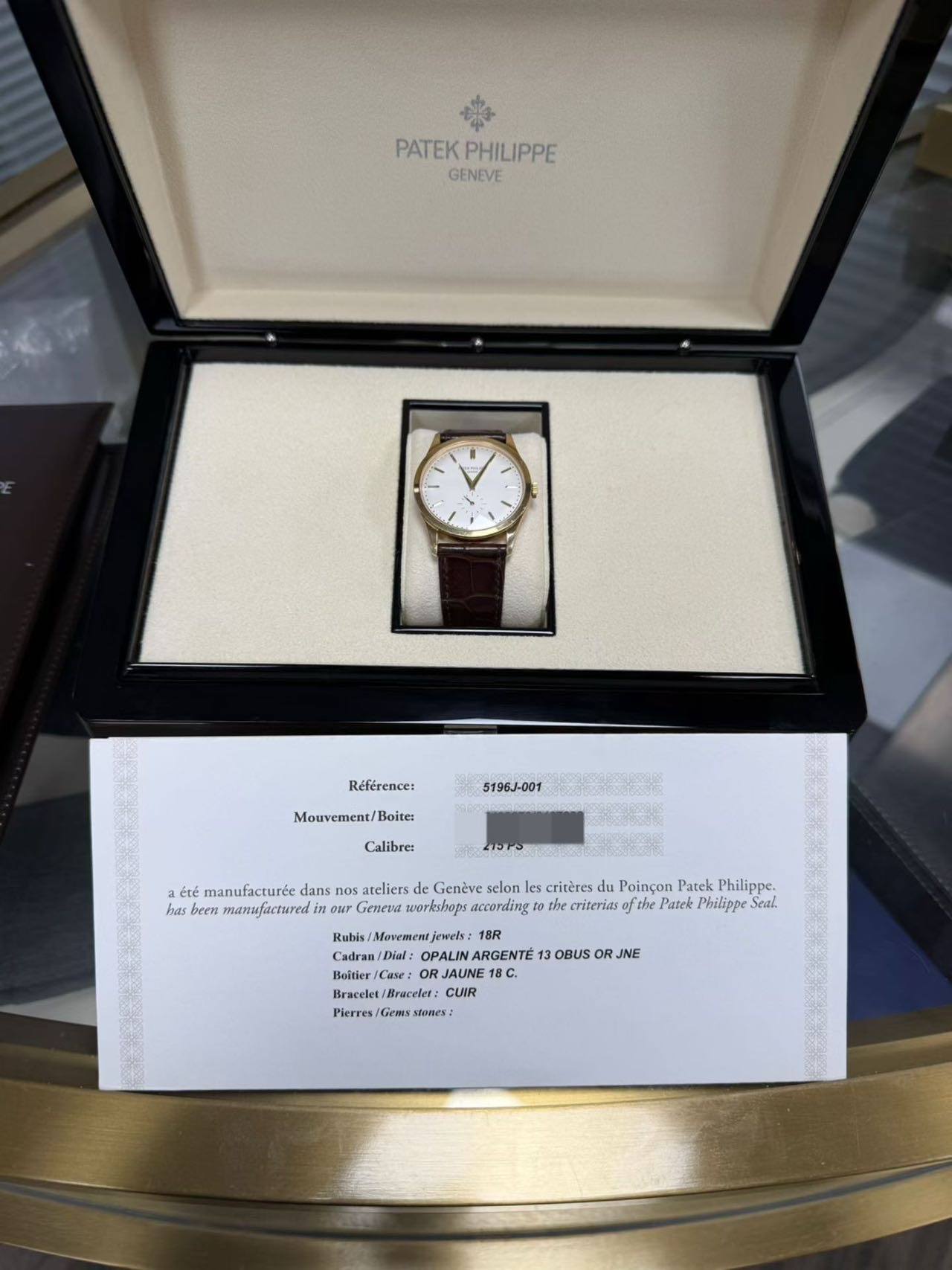 May be an image of wrist watch and text that says 'PATEK PATEKPHILIPPE PHILIPPE GENEVE Référence: 5196J-001 Mouvement/Boites Boites Calibre: たもで0 été manufacturće dans ateliers…