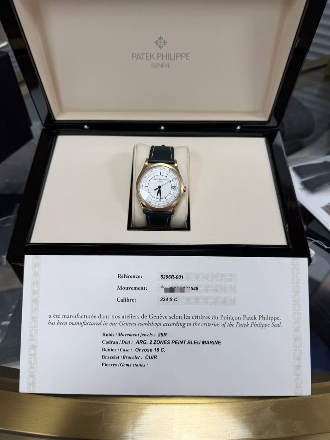 May be an image of wrist watch and text that says '5 PATEK PATEKPHILIPPE PHILIPPE GENEVE Référence: 5296R-001 Mouvement: Calibre: 324S été manufacturée dans nos ateliers Genève…