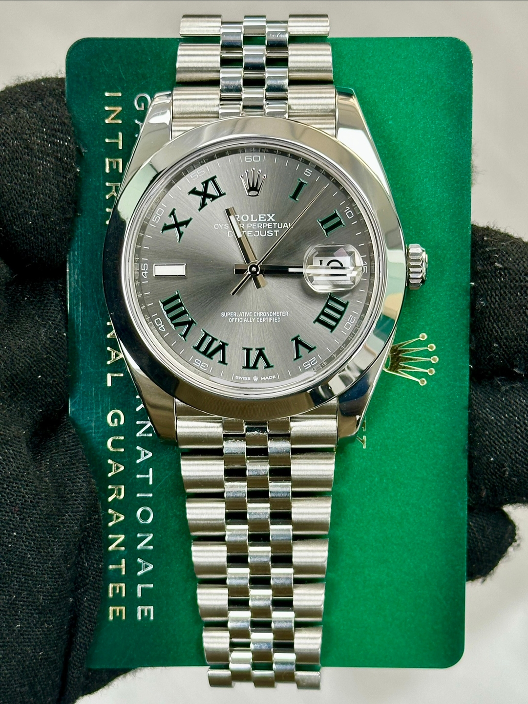 May be an image of wrist watch and text that says '5 5 - 니 XI 155 山トNI 60 50 ROLEX EX OYS ل RPERPET PERPETUA ETUAL EJUST 10 45 15 O0 ស SUPERLATIN CHRONCHETEA OFFIGIALL…