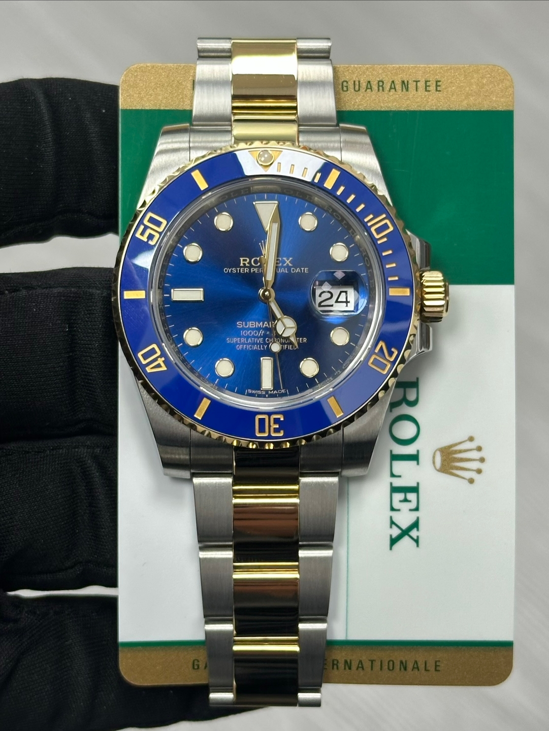 May be an image of wrist watch and text that says 'GUARANTEE 50 RC RO OYSTER EX X JAL ALDATE 10 24 SUBMAI? UPEBLATE 1000ft OOf+ OFFICIALLY TER 40 I サ味まん 30 こ S 20 ROLEX'