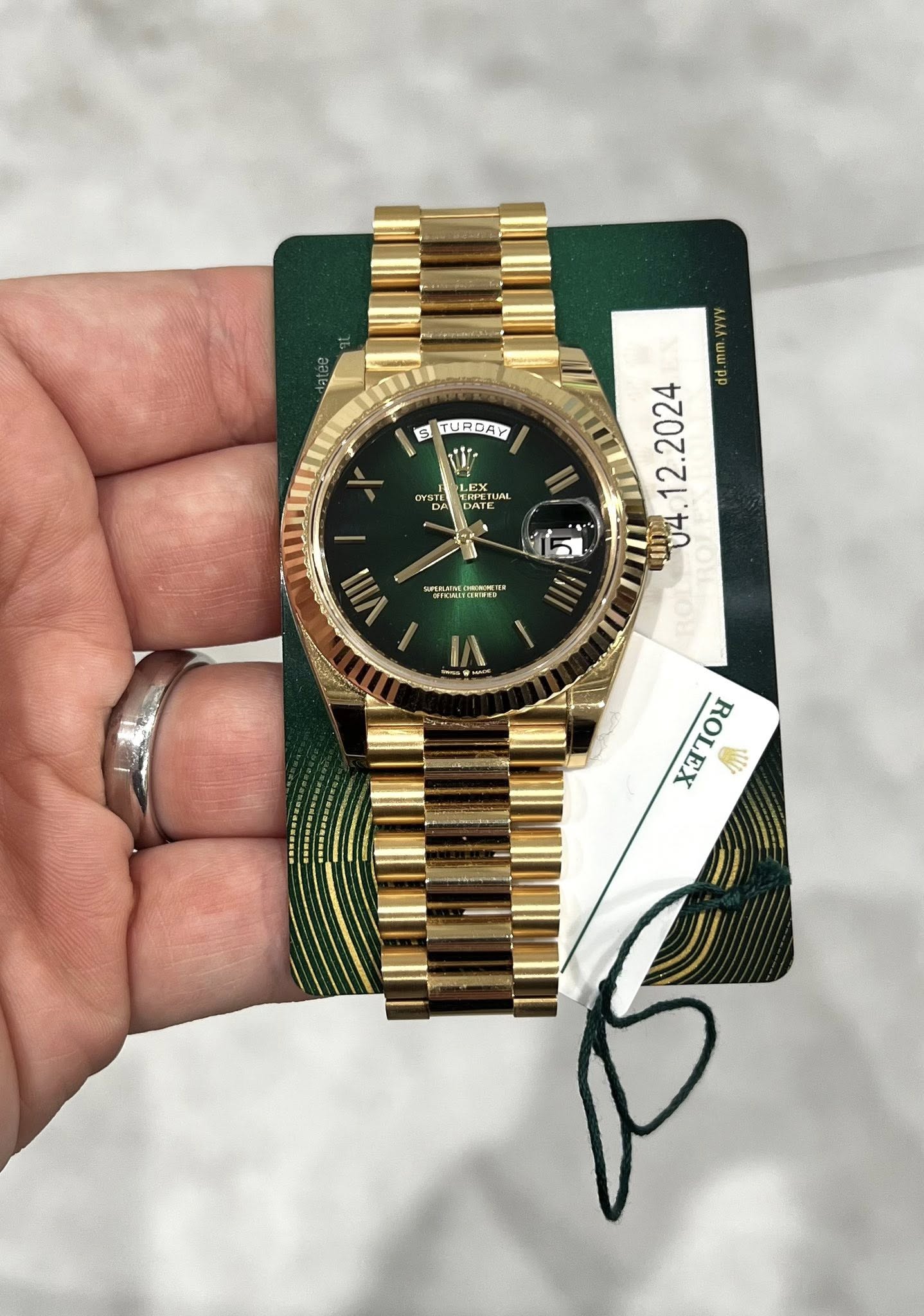 May be an image of wrist watch and text