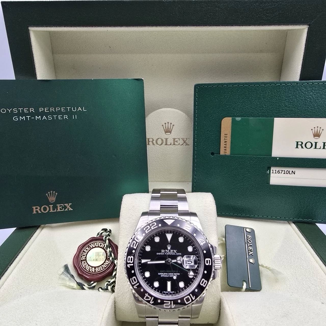 May be an image of wrist watch and text that says 'OYSTER OYSTERPERPETUAL PERPETUAL TUAL GMT-MASTER 11 GMT- MAS TER ROLEX ROL ROLEX 116710LN WATCH 22 20 18 제활을 KTM ROLEX EX…
