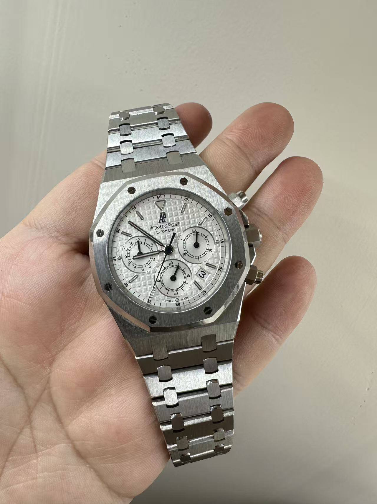 May be an image of wrist watch and text